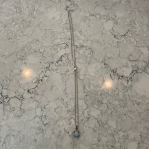 Adjustable length Kendra Scott blue stone necklace. Never worn.